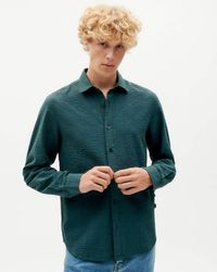 Chemise à carreaux en coton bio | bleu "bottle green checks seersucker thomas shirt"